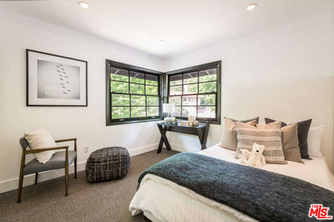 1374 Stradella Road Los Angeles, CA 90077 - Photo 35 of 47 a bedroom with a bed and a large window