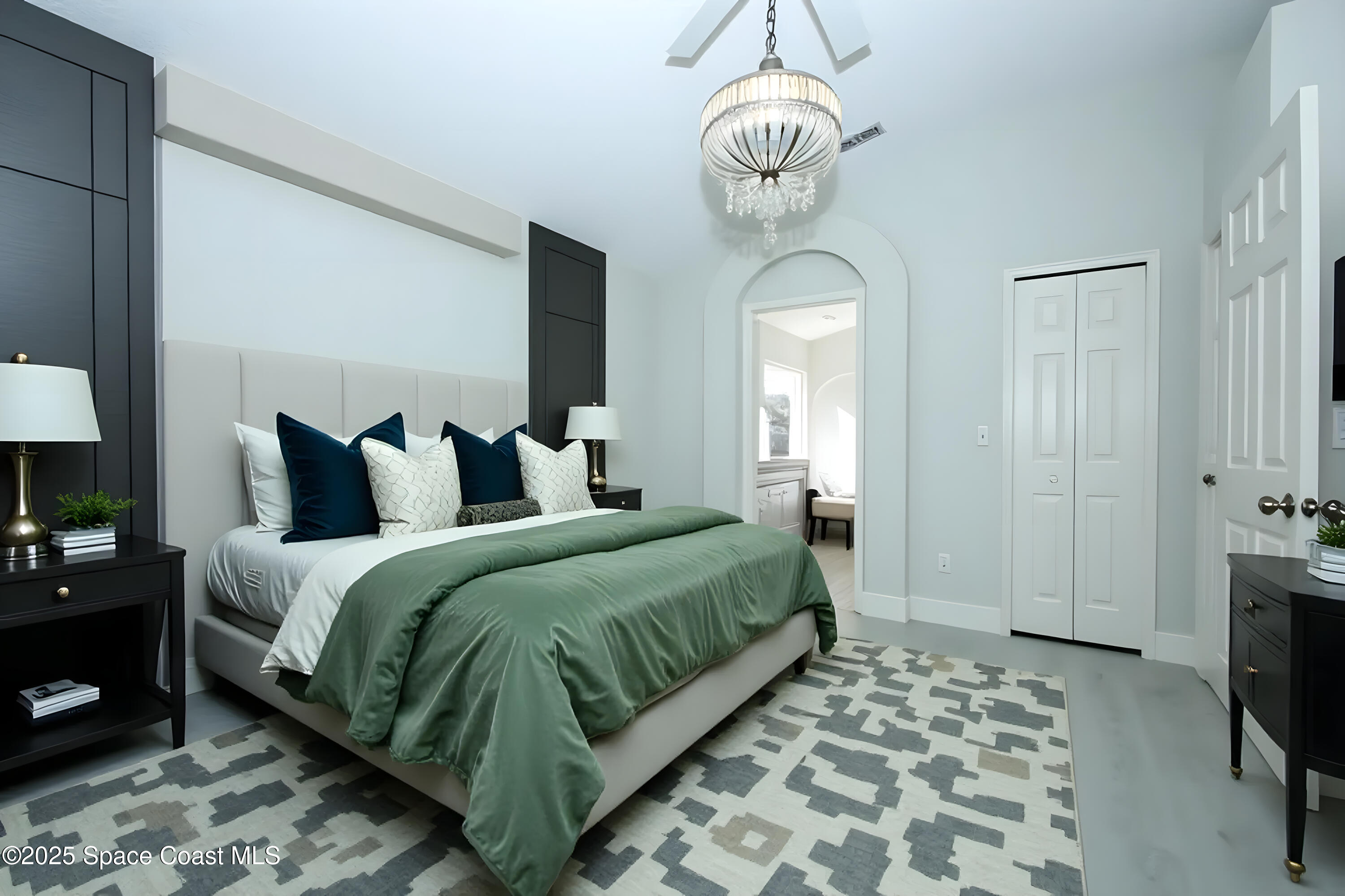 3700 Becontree Place Oviedo, FL 32765 - Photo 13 of 39 a bedroom with bed and a chandelier