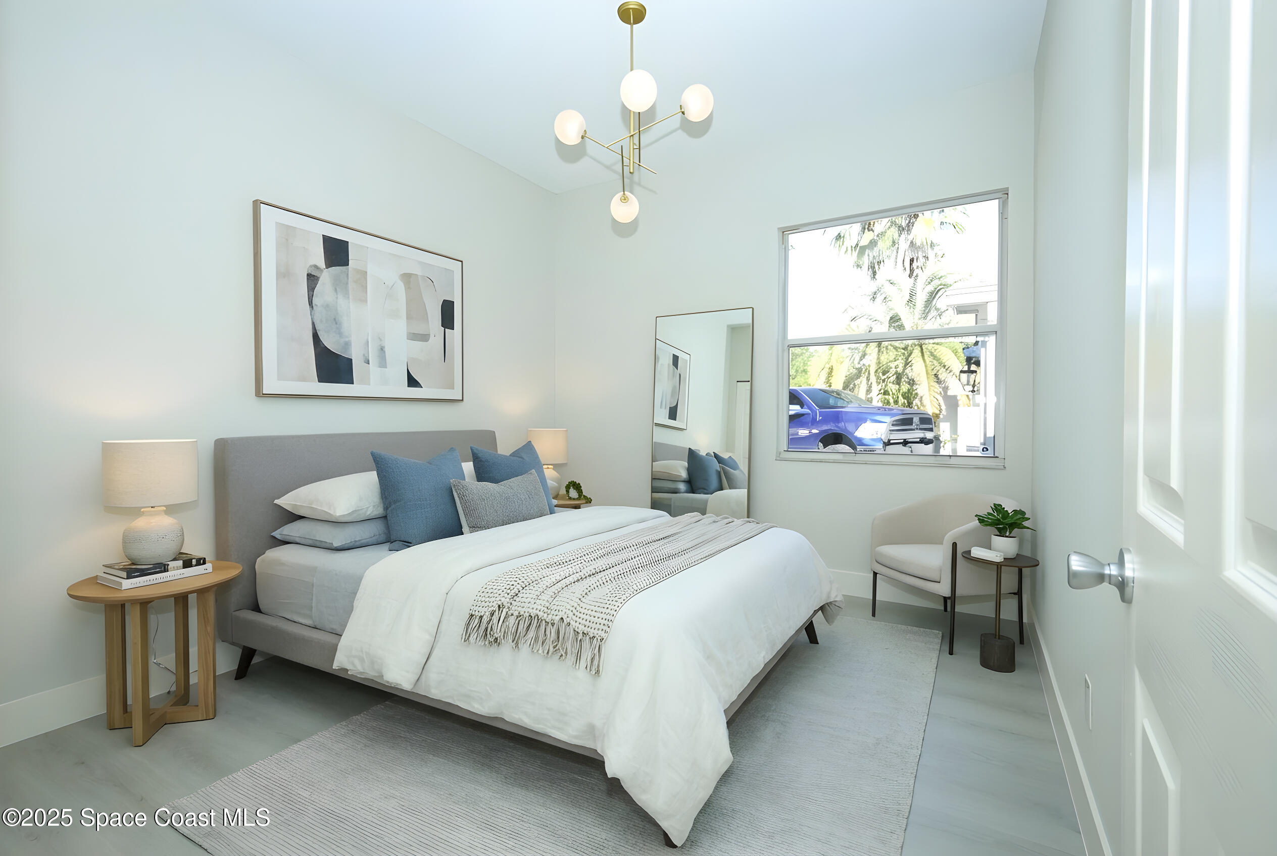 3700 Becontree Place Oviedo, FL 32765 - Photo 22 of 39 a bedroom with a bed chandelier and a window
