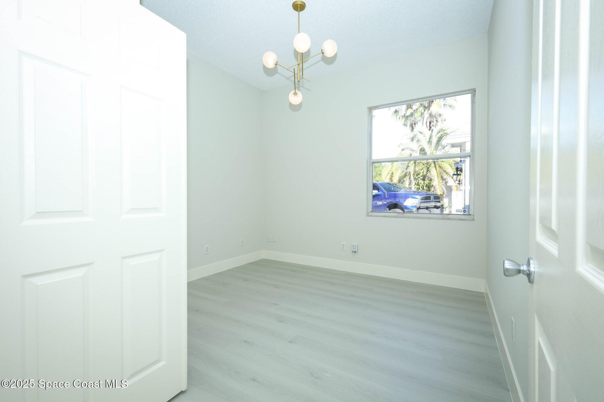 3700 Becontree Place Oviedo, FL 32765 - Photo 23 of 39 an empty room with windows and fan