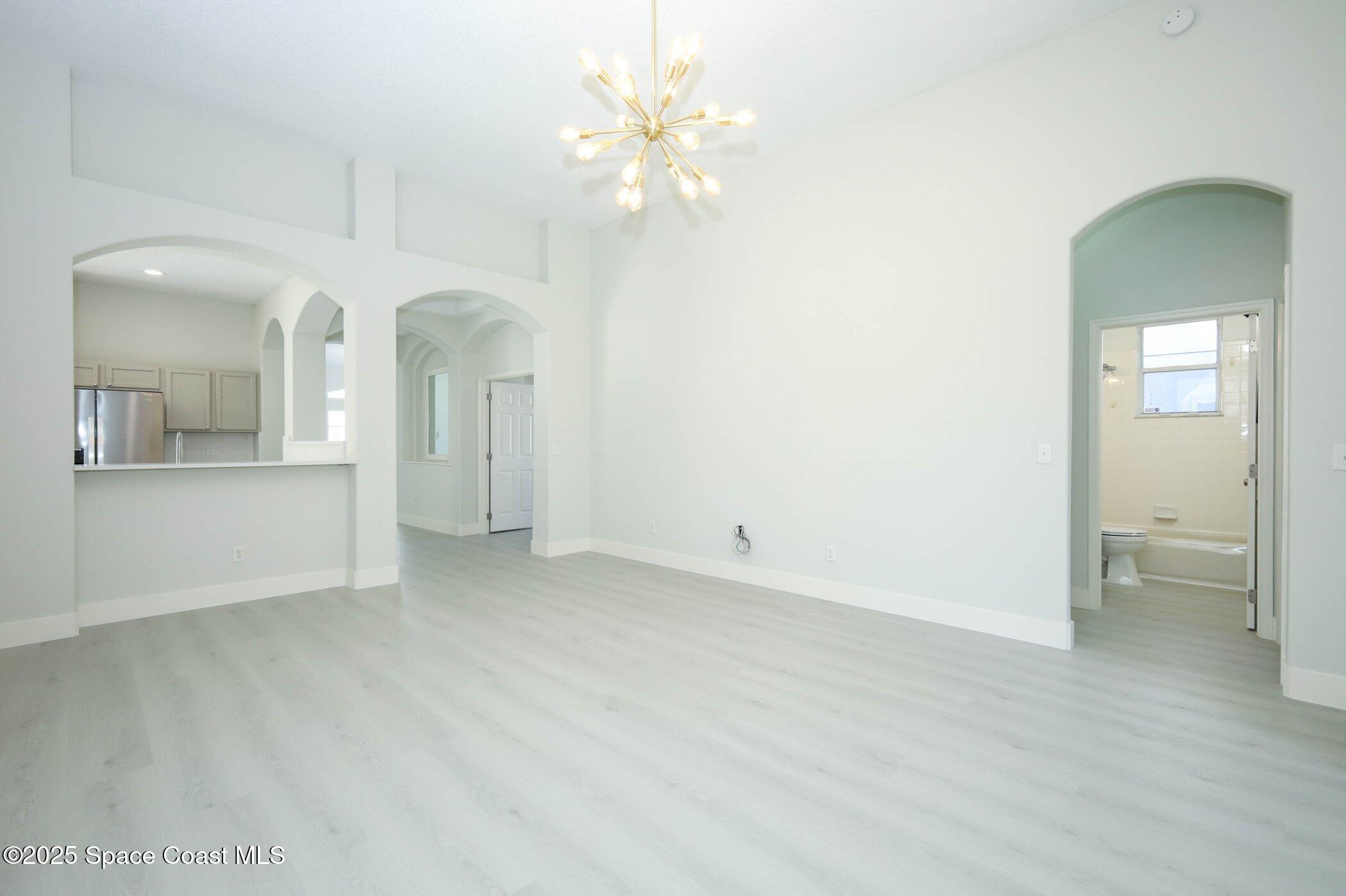 3700 Becontree Place Oviedo, FL 32765 - Photo 25 of 39 wooden floor in an empty room