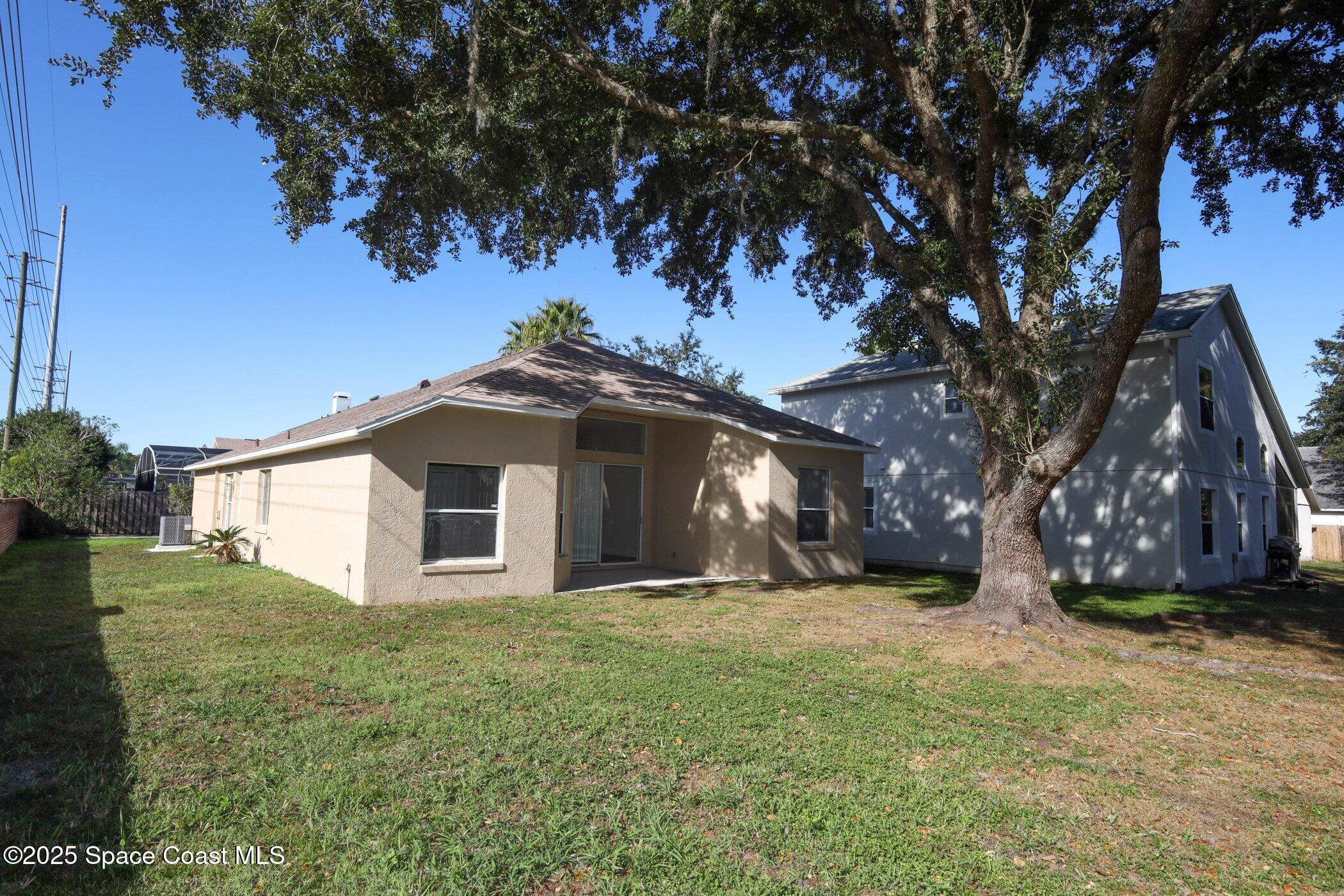 3700 Becontree Place Oviedo, FL 32765 - Photo 39 of 39 a view of a house with a yard