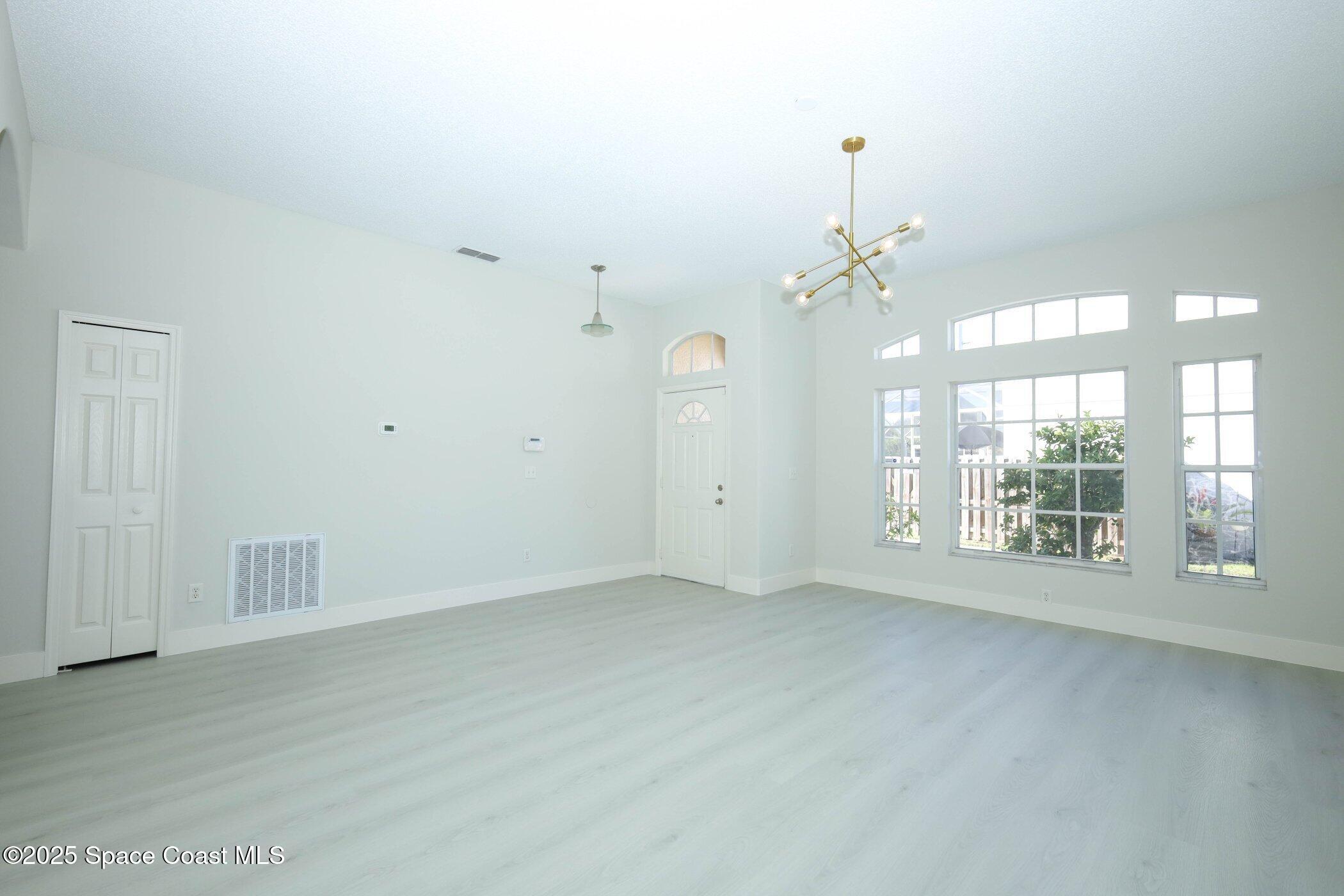 3700 Becontree Place Oviedo, FL 32765 - Photo 5 of 39 a view of an empty room with a window