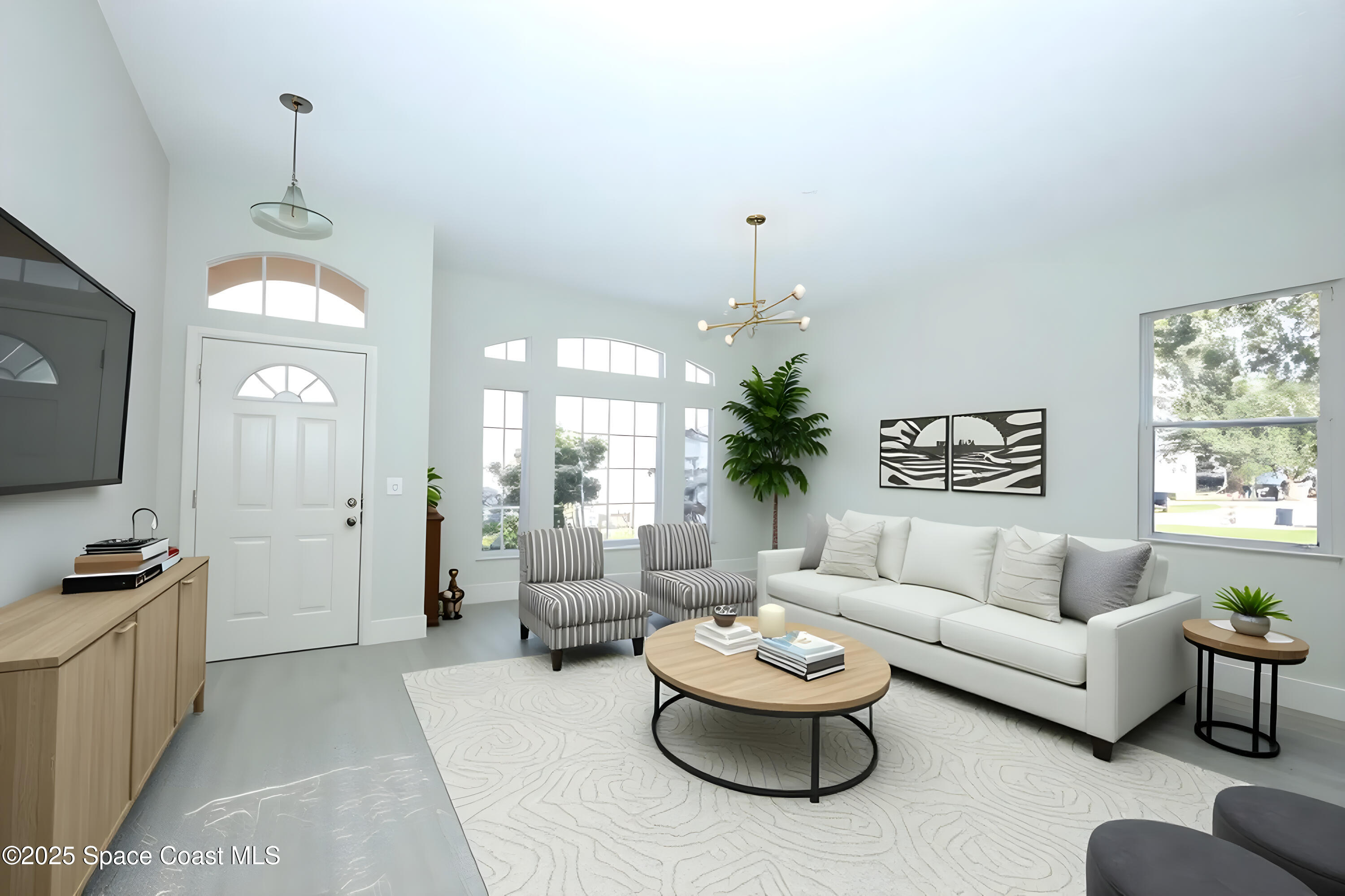 3700 Becontree Place Oviedo, FL 32765 - Photo 7 of 39 a living room with furniture and a flat screen tv