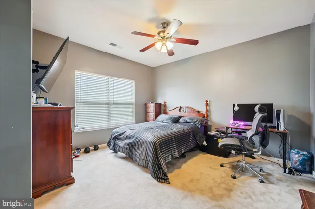 a bedroom with bed and a window