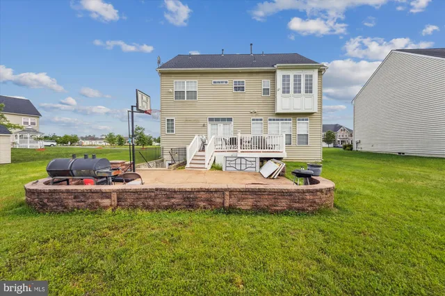 a view of a house with a yard porch and sitting area