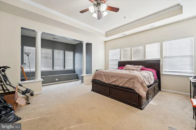 a bedroom with a bed and a table