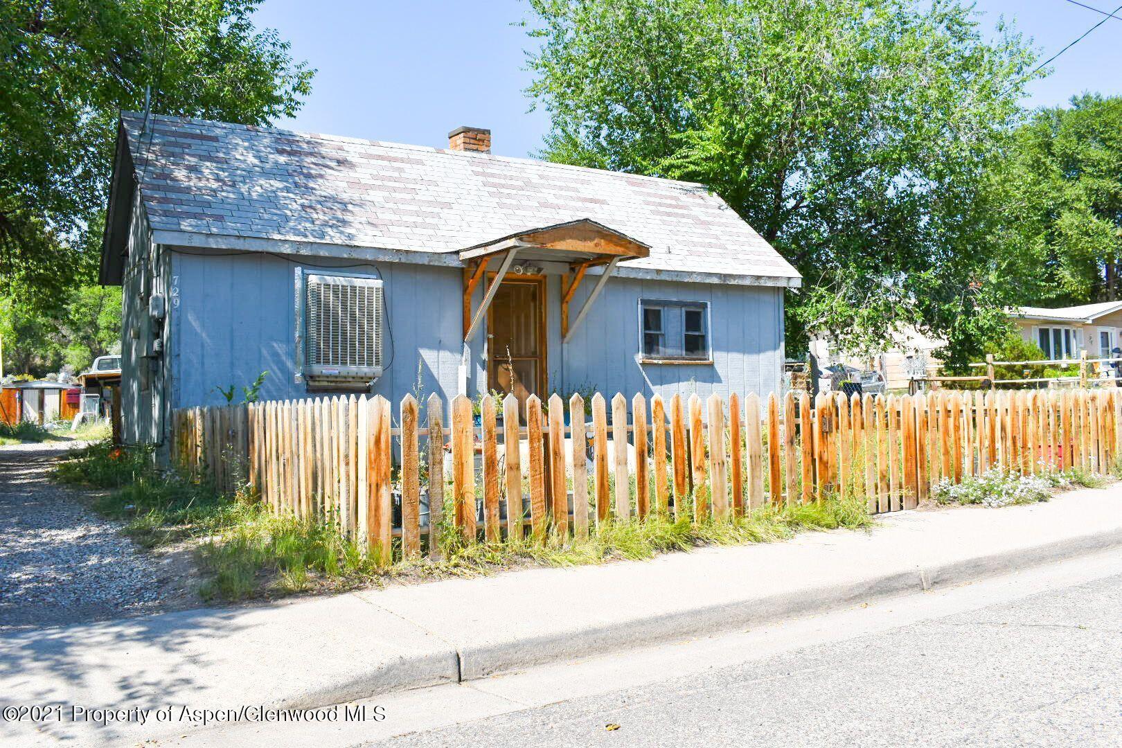 729 Park Avenue Rifle, CO 81650 - Photo 2 of 4 a front view of house with wooden fence