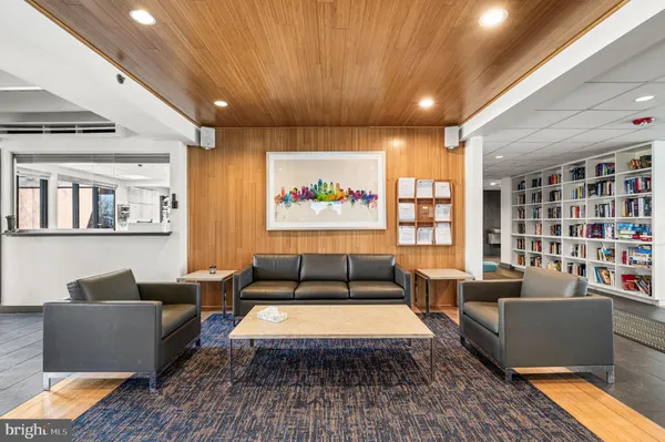 a living room with furniture rug and window