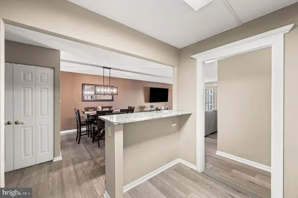 a bathroom with a sink mirror vanity and toilet
