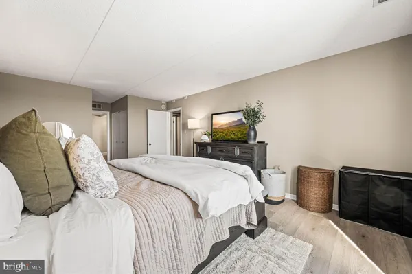 a bathroom with a sink a toilet and shower curtain