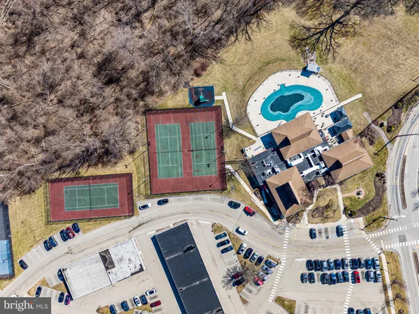 a view of a balcony with chair and chairs