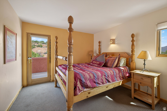 3617 Red Rock Drive Moab, UT 84532 - Photo 75 of 79 Bedroom with access to outside and carpet floors