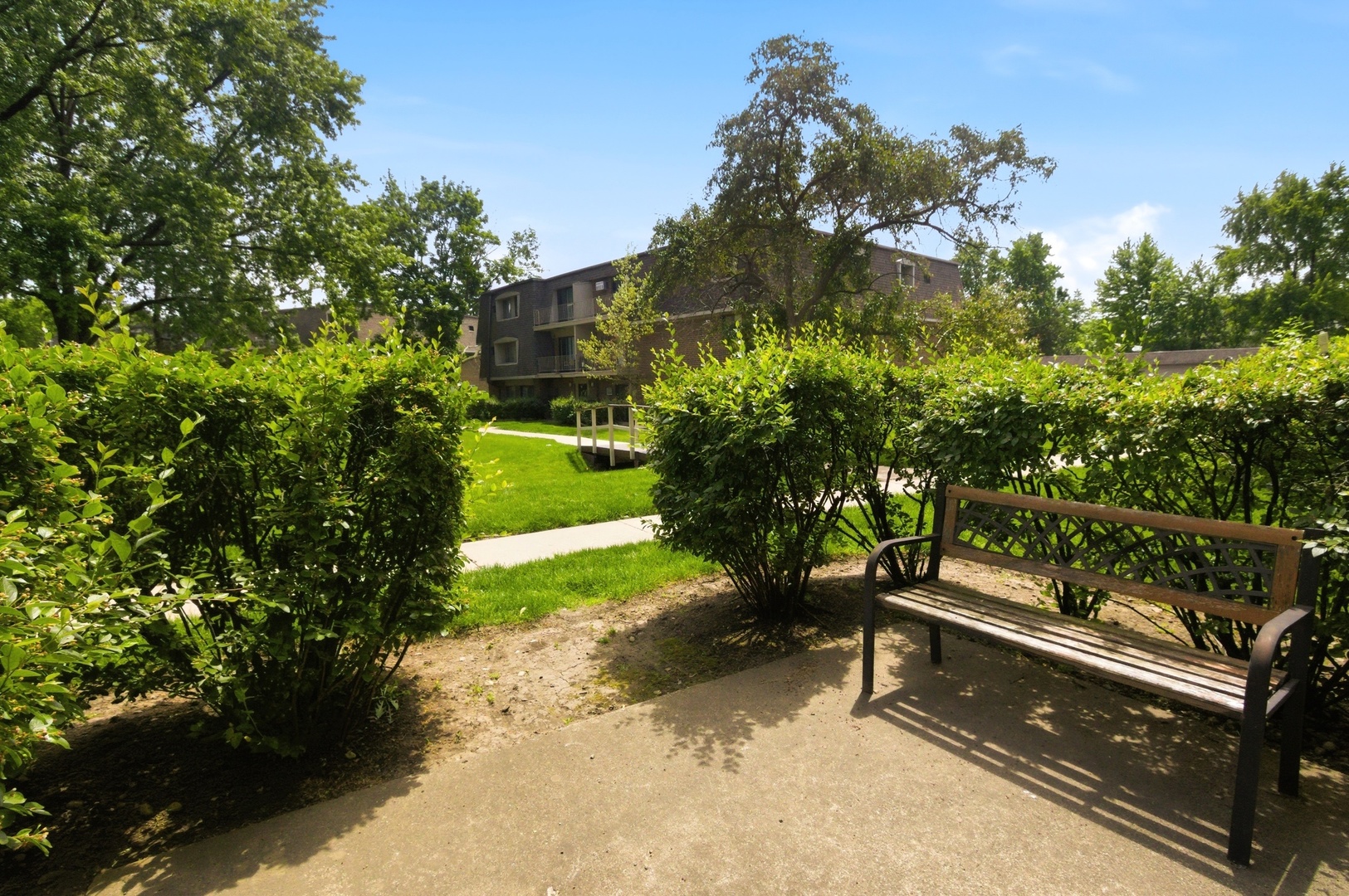 154 East Bailey Road, Unit D Naperville, IL 60565 - Photo 2 of 20 a view of outdoor space with garden