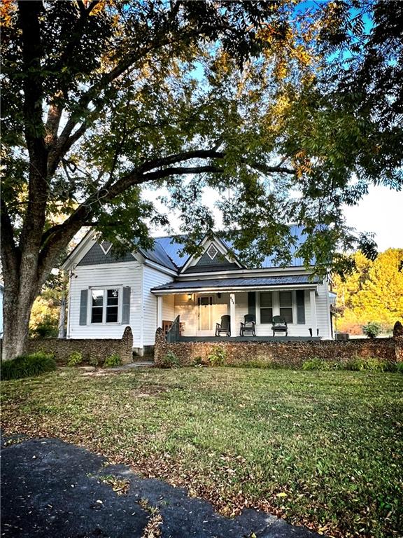 147 411th Highway Northeast Ranger, GA 30734 - Photo 1 of 1 front view of house with a yard