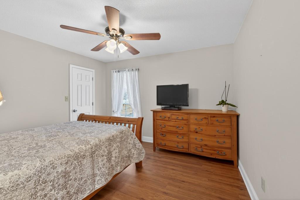 335 Ranger Way Braselton, GA 30517 - Photo 18 of 63 a bedroom with a bed and a flat screen tv