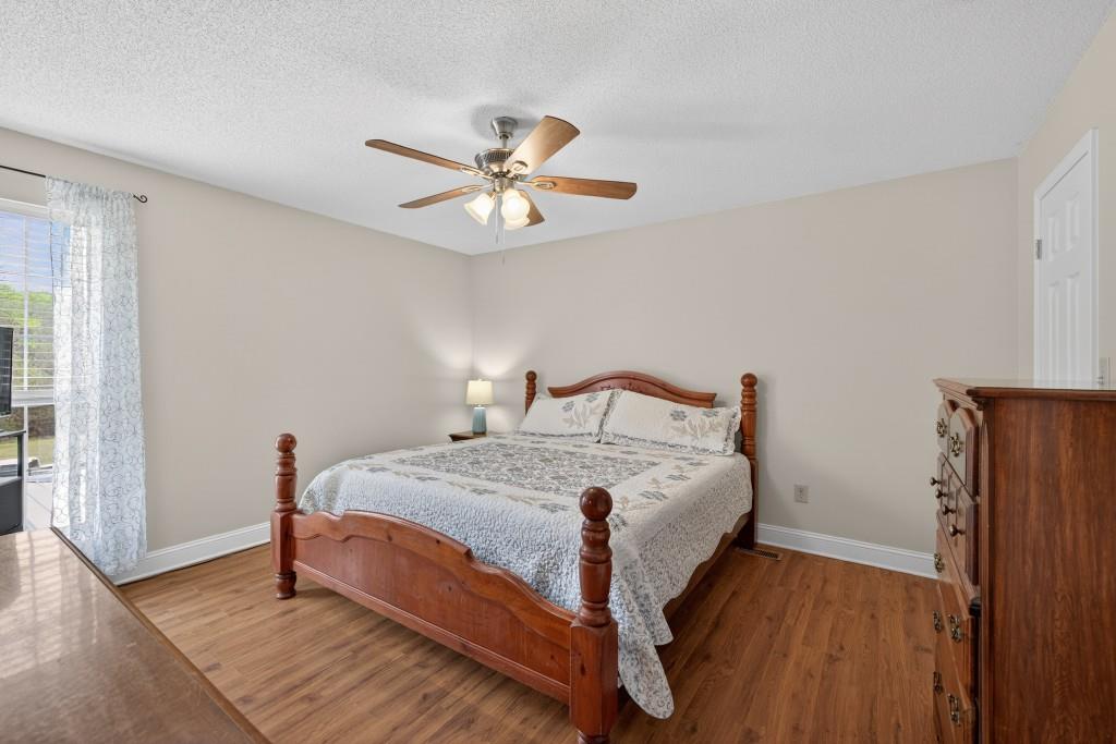 335 Ranger Way Braselton, GA 30517 - Photo 21 of 63 a bedroom with a bed and a window