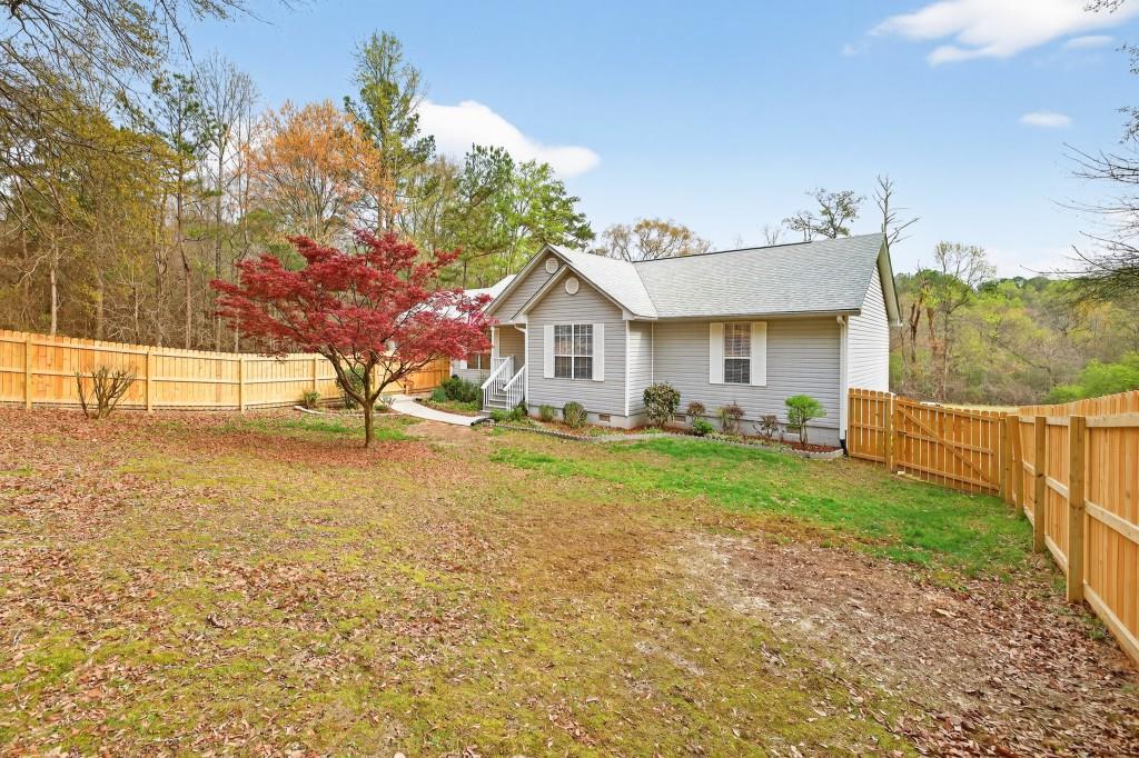 335 Ranger Way Braselton, GA 30517 - Photo 28 of 63 a view of backyard of the house
