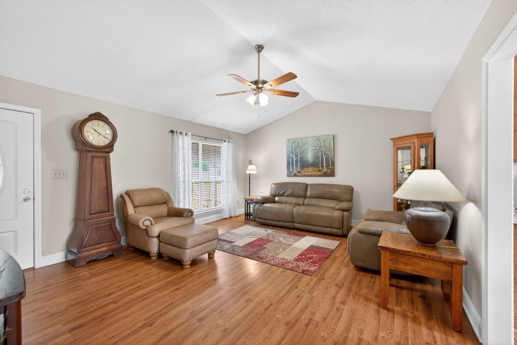 335 Ranger Way Braselton, GA 30517 - Photo 3 of 63 a living room with furniture and a wooden floor