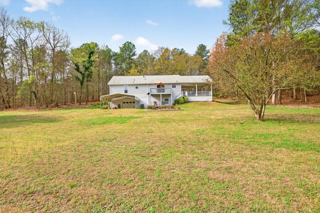 335 Ranger Way Braselton, GA 30517 - Photo 35 of 63 a view of a swimming pool with an outdoor space and seating area