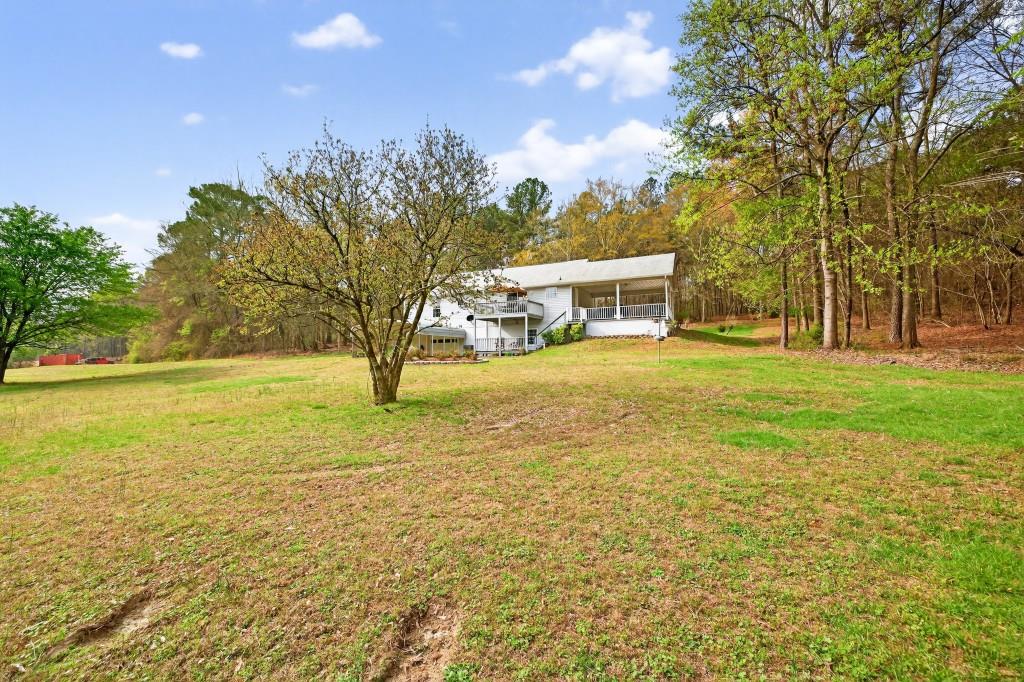335 Ranger Way Braselton, GA 30517 - Photo 36 of 63 a view of a ocean with a yard and a large tree