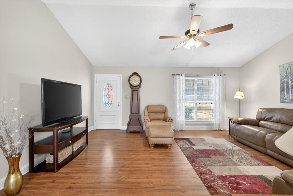 335 Ranger Way Braselton, GA 30517 - Photo 4 of 63 a living room with furniture and a flat screen tv