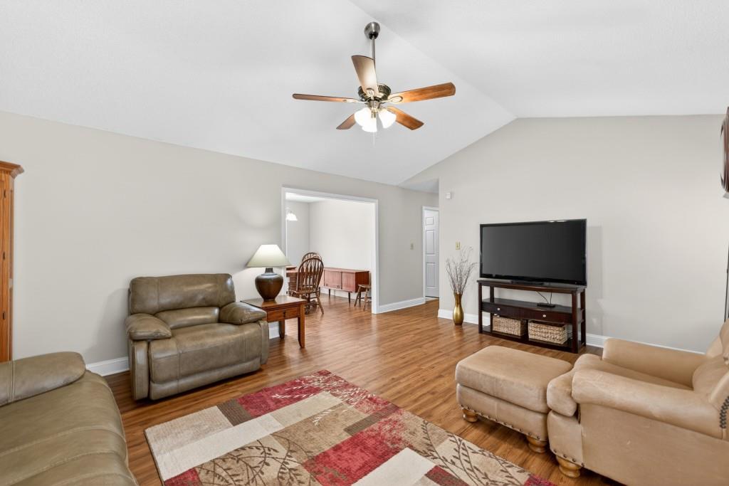 335 Ranger Way Braselton, GA 30517 - Photo 5 of 63 a living room with furniture and a flat screen tv