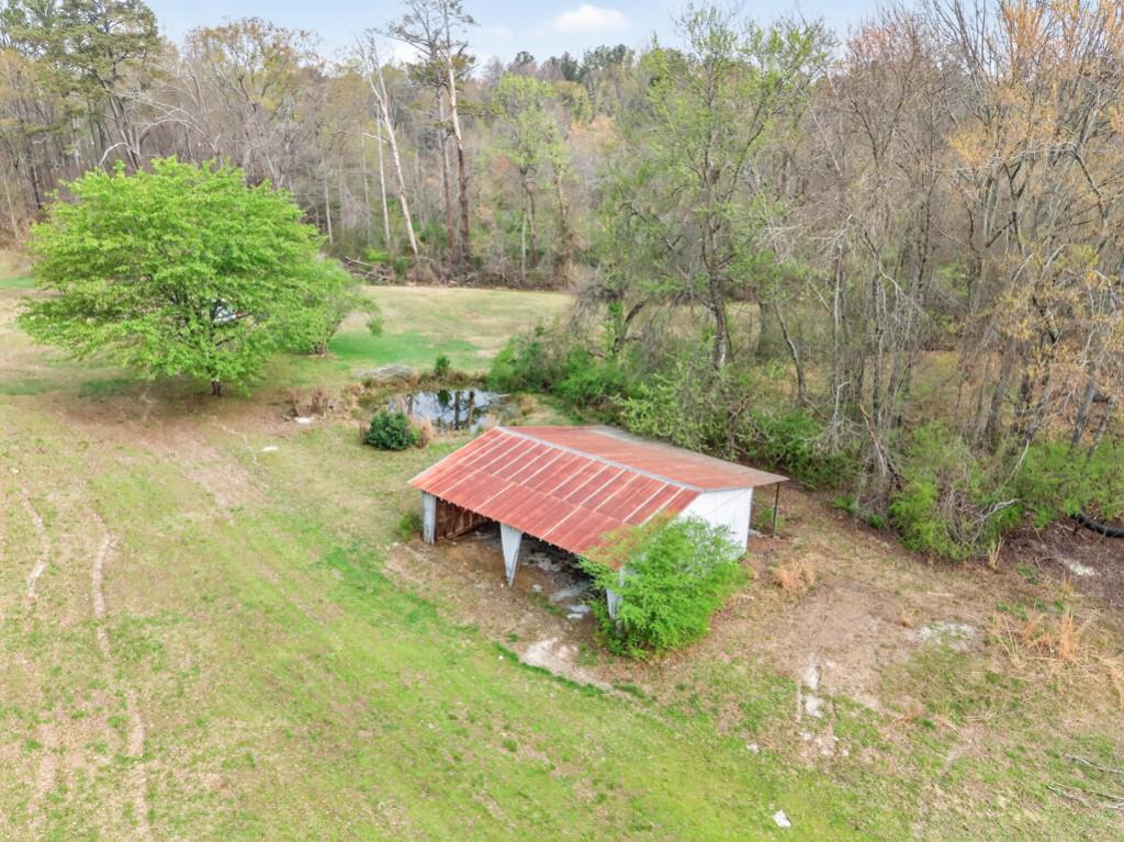 335 Ranger Way Braselton, GA 30517 - Photo 54 of 63 a view of a backyard with table and chairs plants and large trees