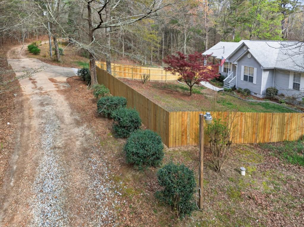335 Ranger Way Braselton, GA 30517 - Photo 63 of 63 a view of a lake with a house in the background