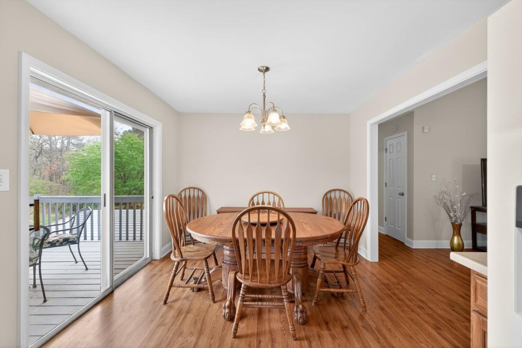335 Ranger Way Braselton, GA 30517 - Photo 7 of 63 a view of a dining room with furniture window and wooden floor