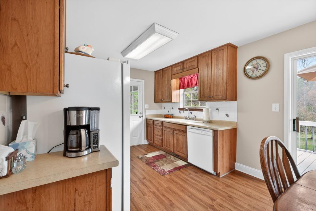335 Ranger Way Braselton, GA 30517 - Photo 9 of 63 a kitchen with a sink cabinets and window