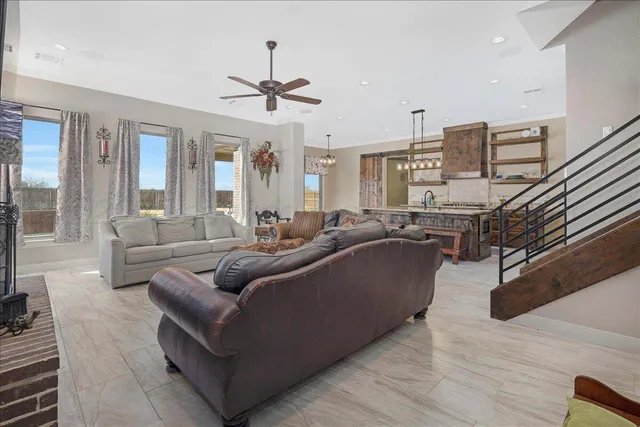 a kitchen with stainless steel appliances granite countertop a stove a sink and a wooden cabinets