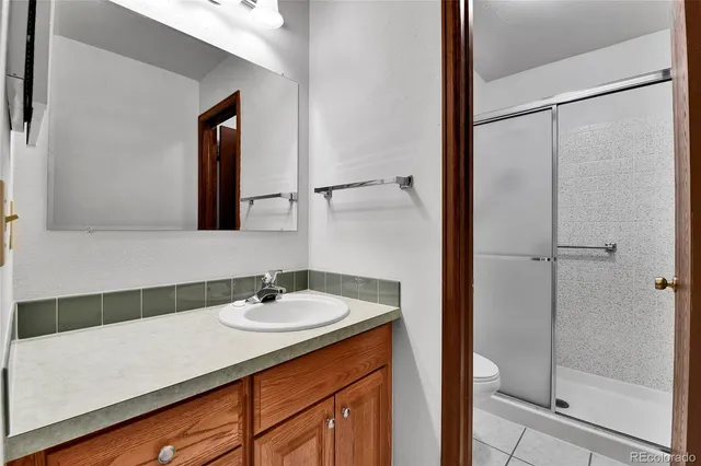 a view of hallway with closet and bathroom