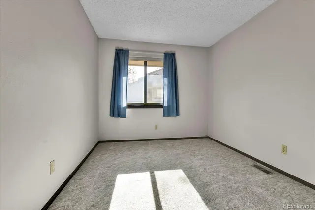 a bathroom with a sink a toilet a mirror a bathtub and shower