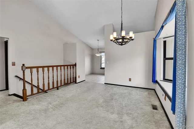 a kitchen with granite countertop a sink stainless steel appliances and cabinets