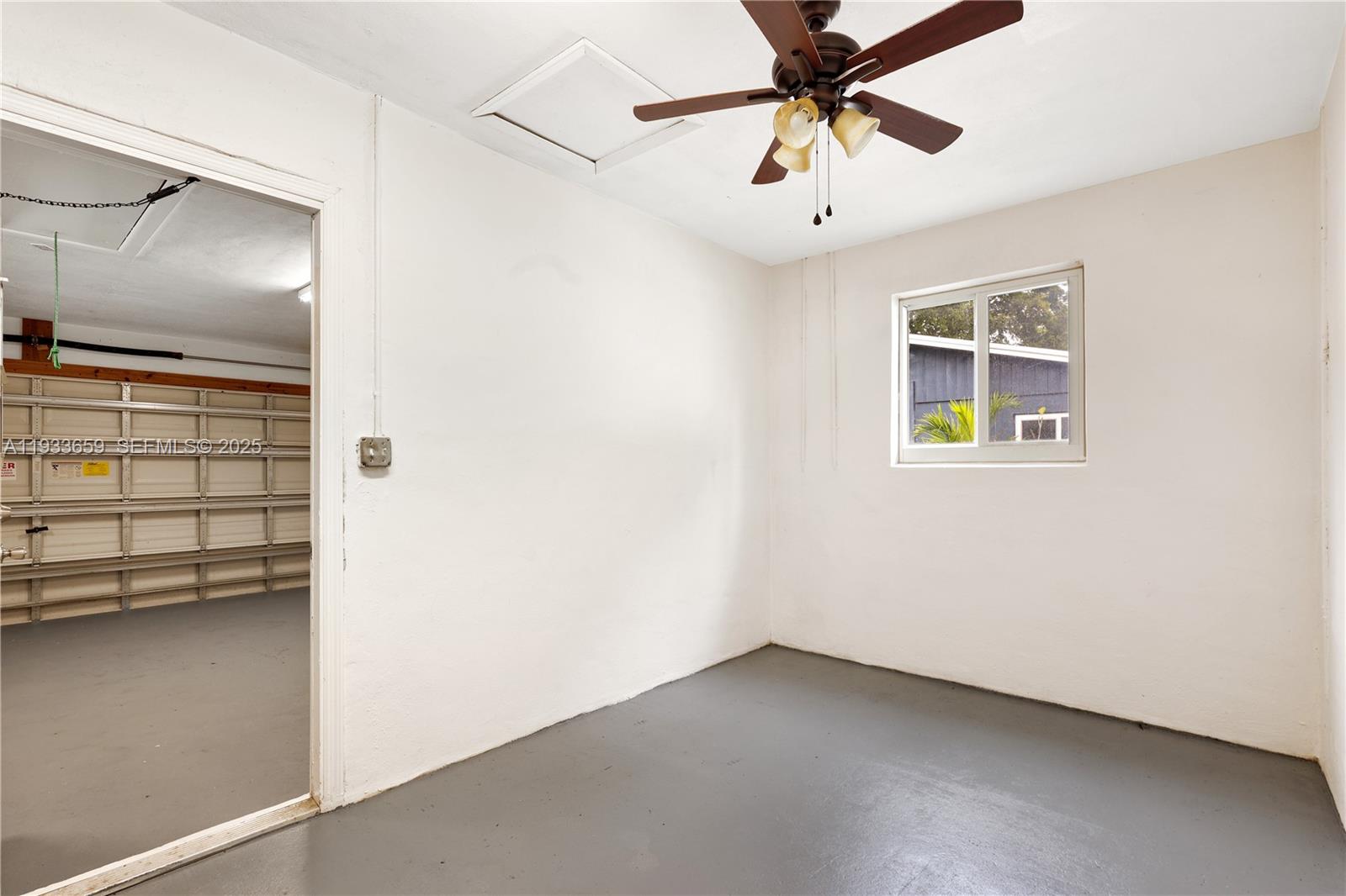 142 Southwest 53rd Avenue Plantation, FL 33317 - Photo 23 of 30 a view of a livingroom with a ceiling fan and window