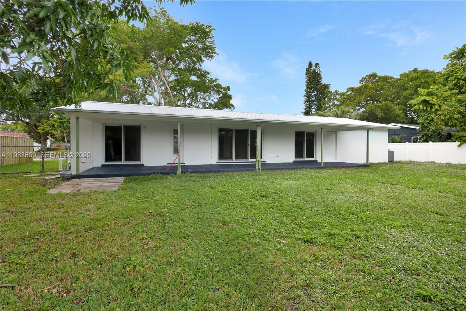 142 Southwest 53rd Avenue Plantation, FL 33317 - Photo 26 of 30 a view of a house with backyard porch and garden