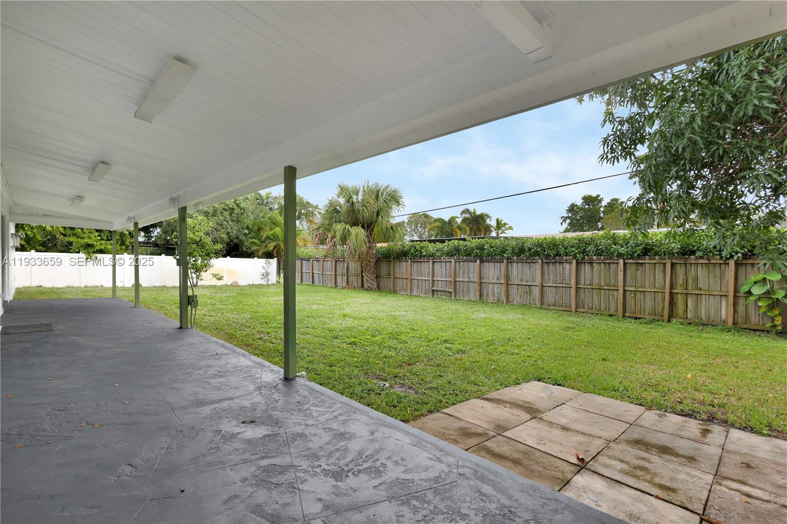 142 Southwest 53rd Avenue Plantation, FL 33317 - Photo 29 of 30 a view of a yard with a big yard and a trampoline