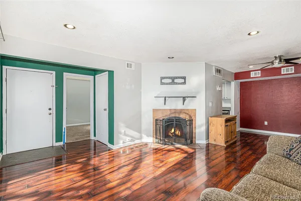 a view of livingroom with furniture and a fireplace