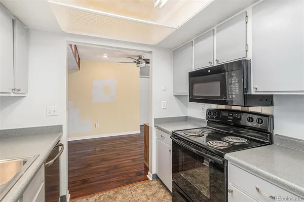 a kitchen with a stove and a microwave
