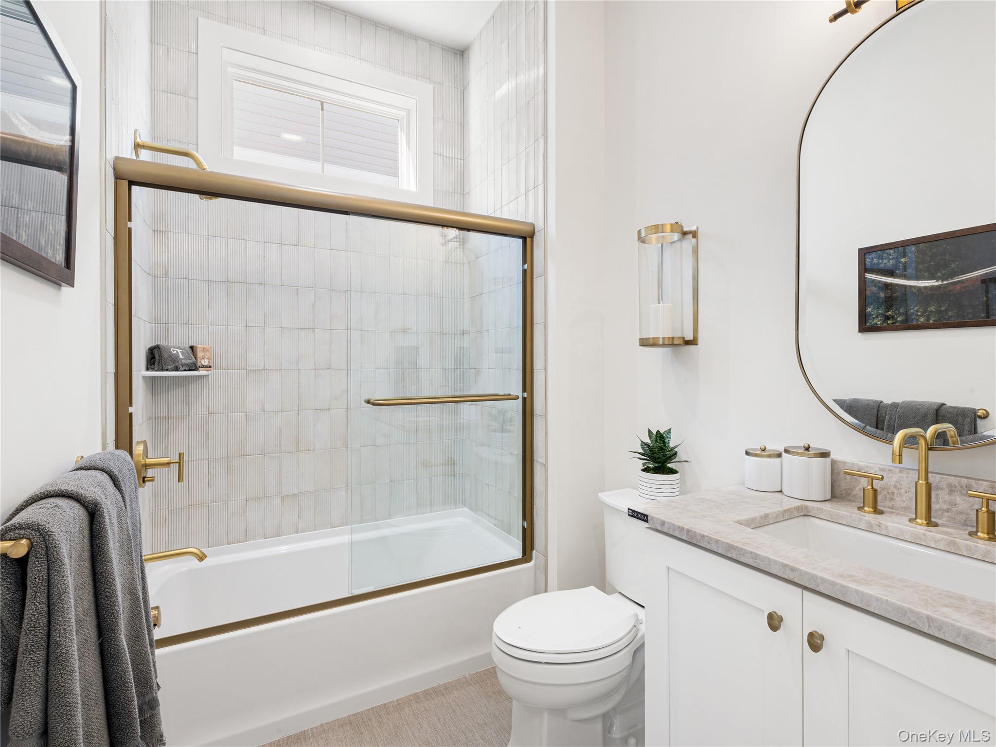 2027 Summit Loop, Unit 87 Carmel, NY 10512 - Photo 13 of 20 a bathroom with a granite countertop sink toilet and shower