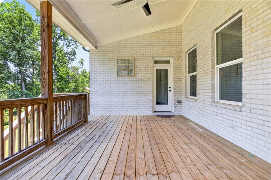 3528 North Bogan Road Buford, GA 30519 - Photo 74 of 79 a view of backyard with a deck and wooden floor