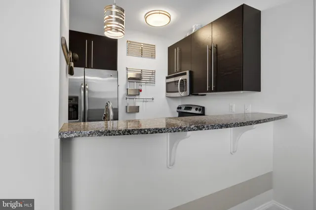 a small space with wooden floor and a window