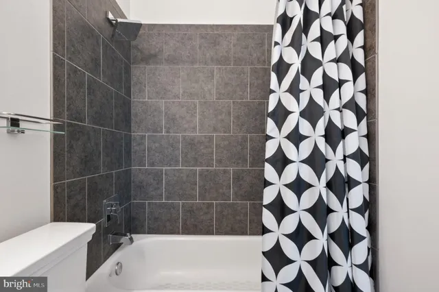 a view of a hallway with washer and dryer