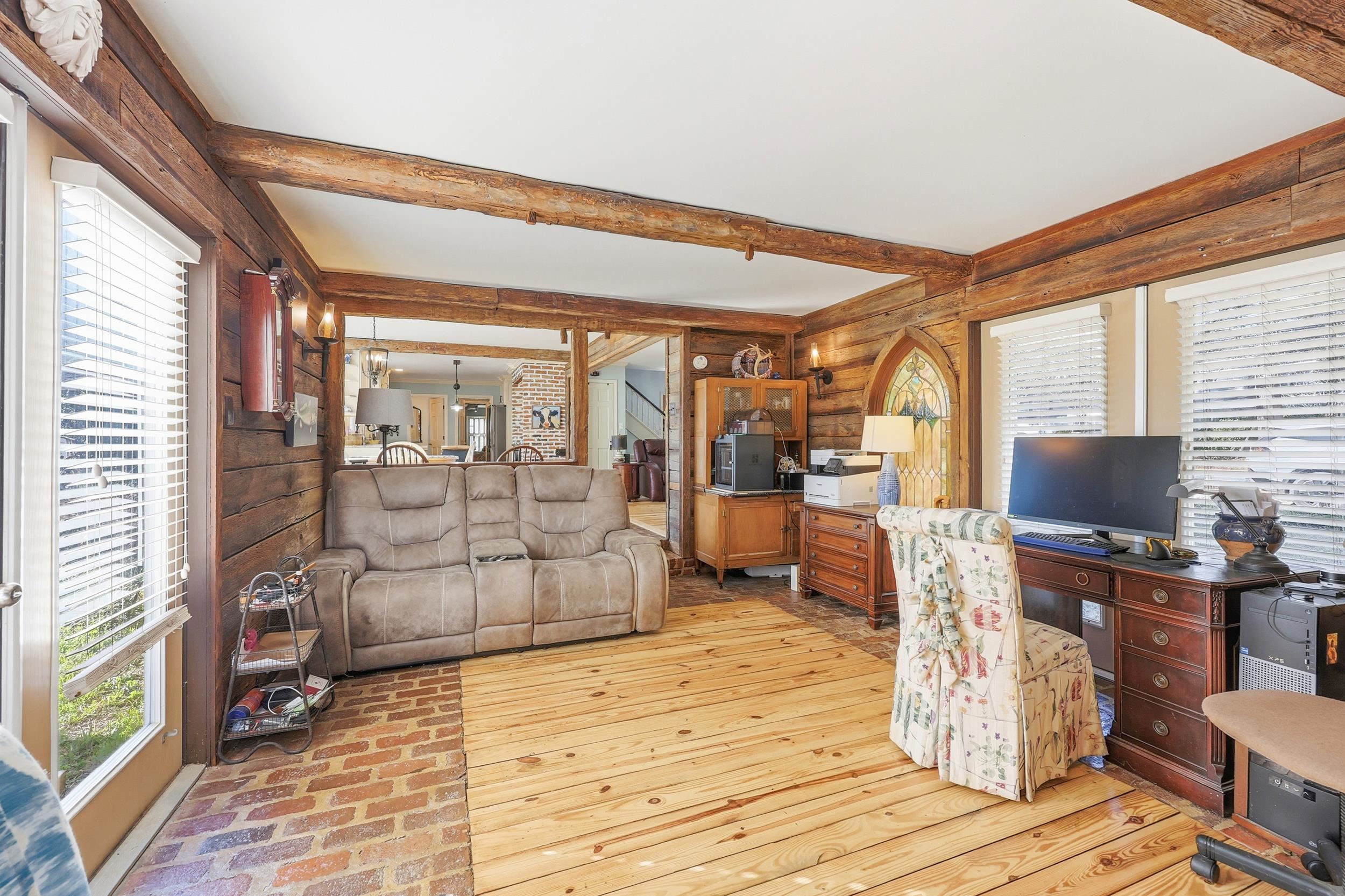 709 Mt Gilead Road Murrells Inlet, SC 29576 - Photo 12 of 38 Living area with beamed ceiling, light wood-style flooring, and stairway