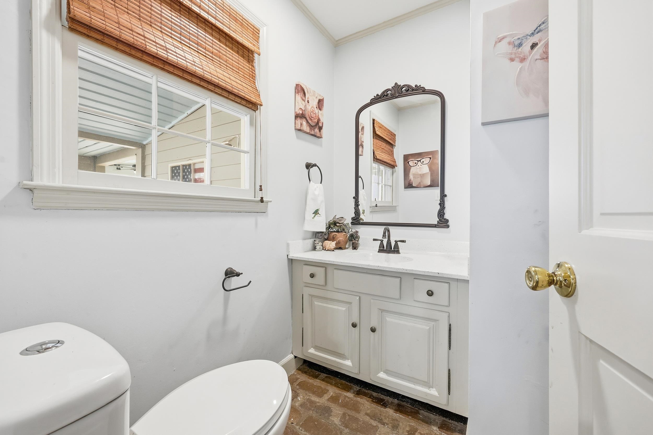 709 Mt Gilead Road Murrells Inlet, SC 29576 - Photo 15 of 38 Bathroom featuring vanity, brick floors, and ornamental molding