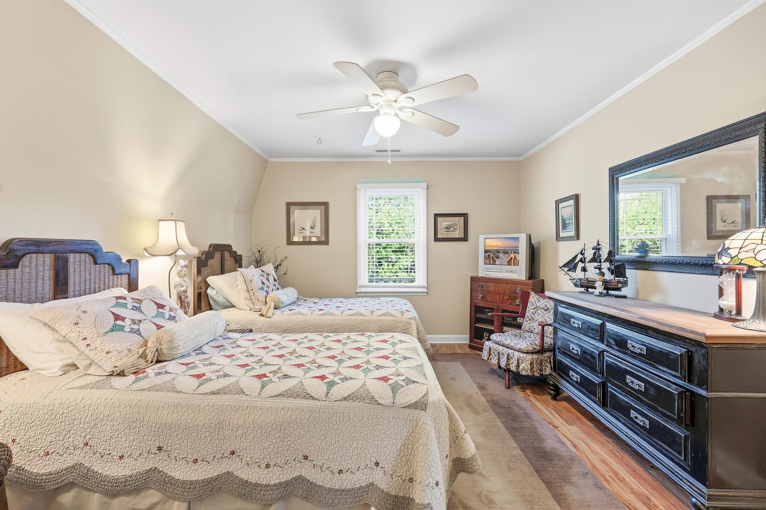 709 Mt Gilead Road Murrells Inlet, SC 29576 - Photo 19 of 38 Bedroom with crown molding, light wood-style flooring, multiple windows, and a ceiling fan