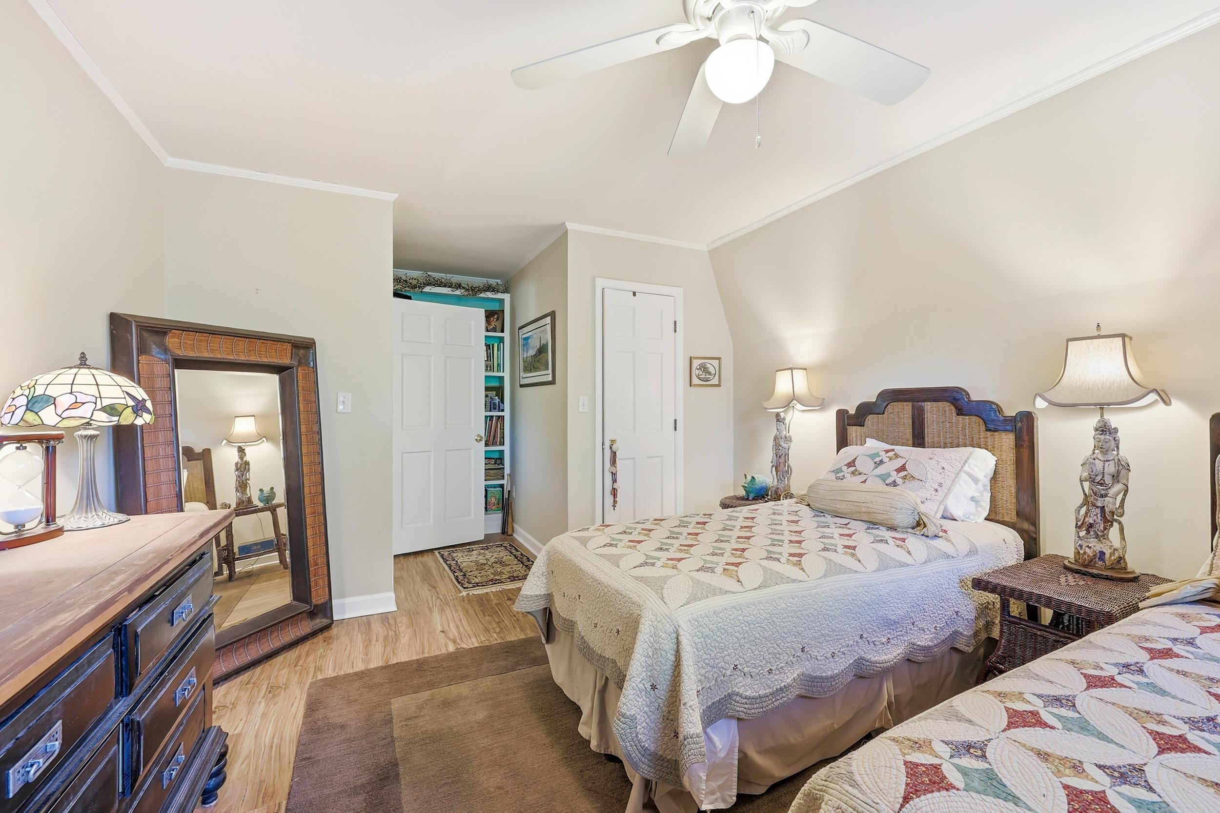 709 Mt Gilead Road Murrells Inlet, SC 29576 - Photo 20 of 38 Bedroom with light wood-style flooring, crown molding, and a ceiling fan