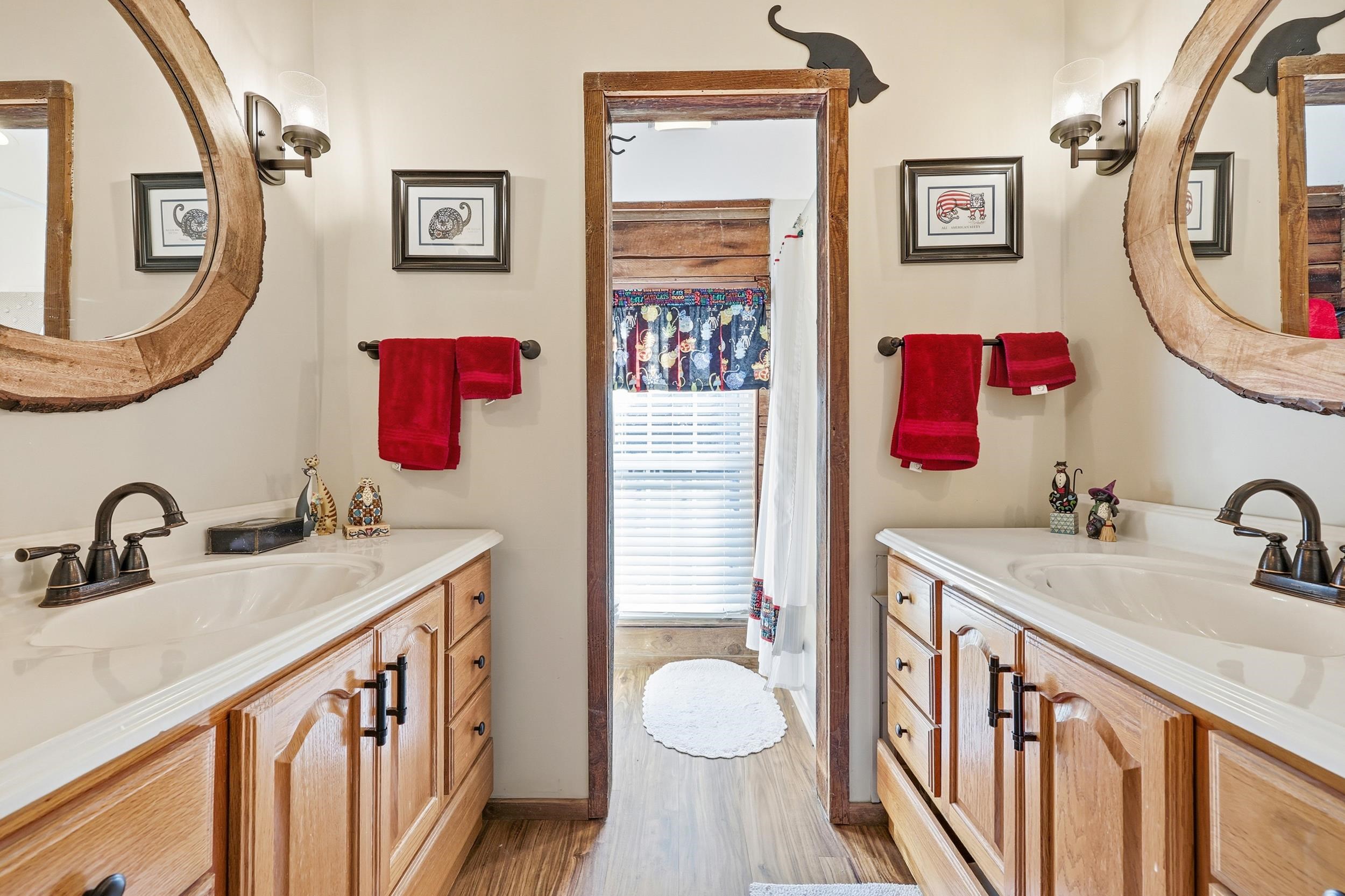 709 Mt Gilead Road Murrells Inlet, SC 29576 - Photo 26 of 38 Bathroom with two vanities and light wood finished floors