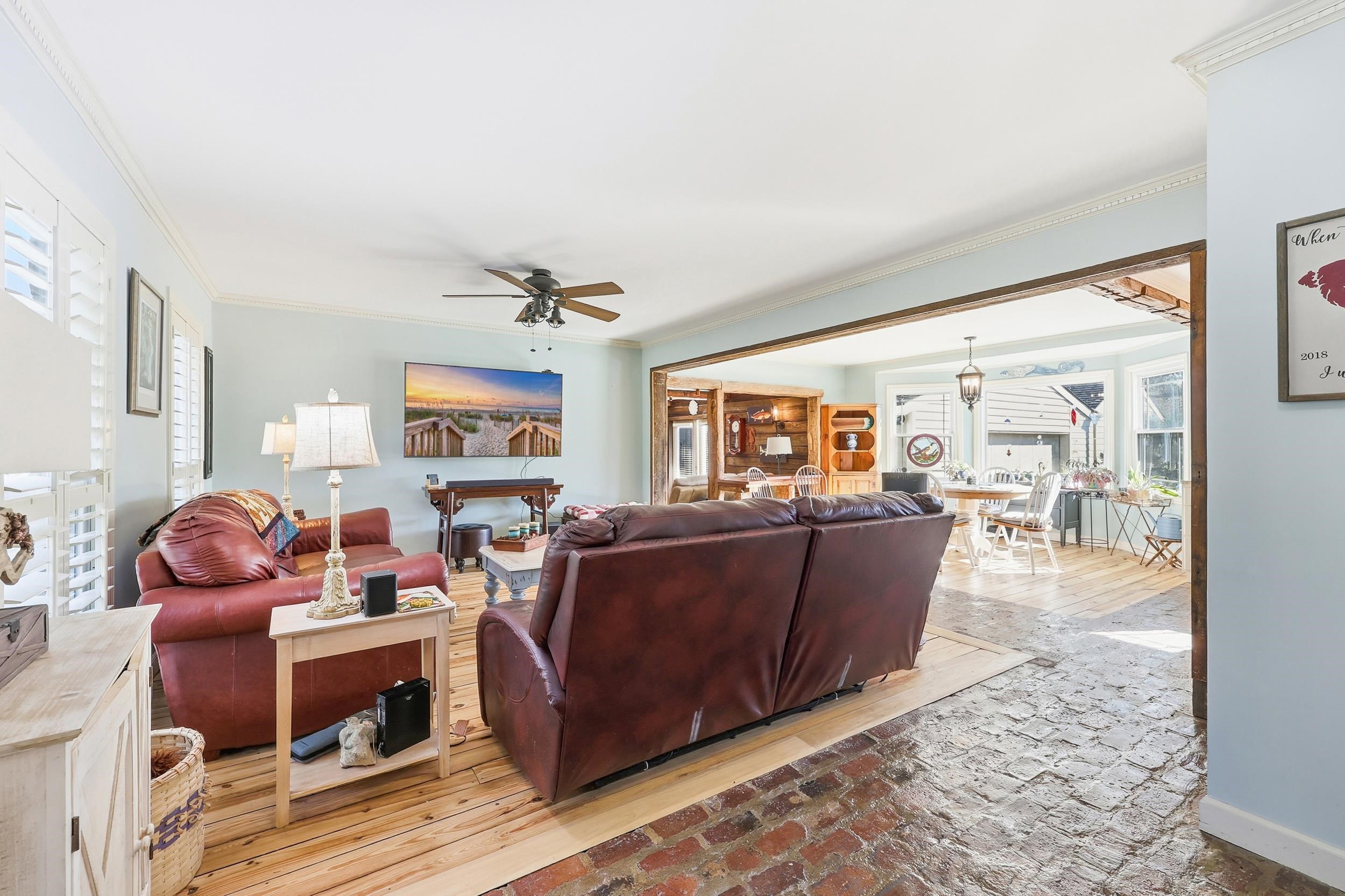 709 Mt Gilead Road Murrells Inlet, SC 29576 - Photo 3 of 38 Living room with ornamental molding, ceiling fan, and brick floors